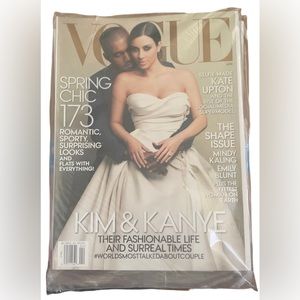 Still in plastic. Kim Kardashian and Kanye West. Vogue 2014